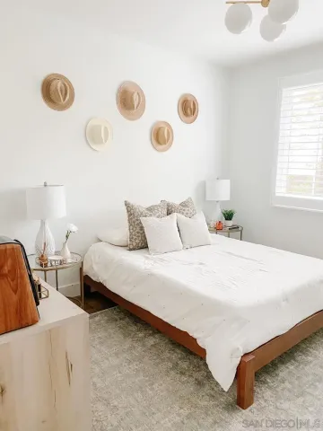 a bedroom with bed and window