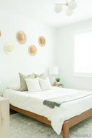a bedroom with a bed and pillows