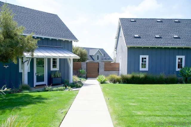 a front view of a house with garden
