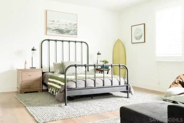 a bedroom with furniture and window