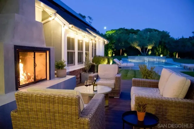 a view of a patio with couches chairs and a potted plant