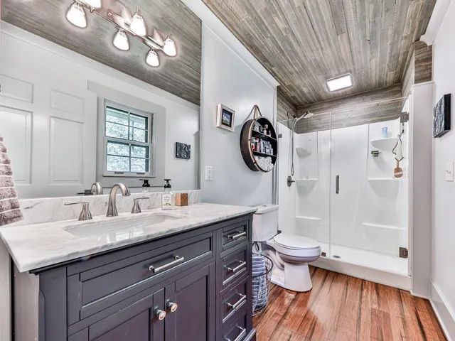 a bathroom with a double vanity sink and a mirror