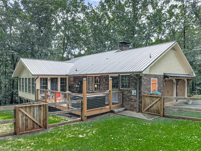 an outdoor space with furniture and garden