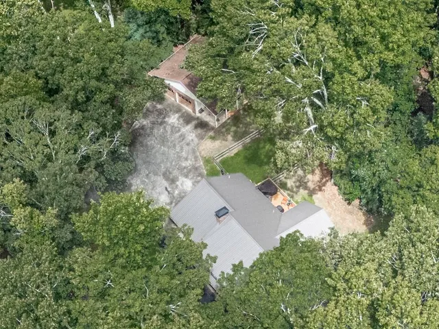 an aerial view of residential house with outdoor space