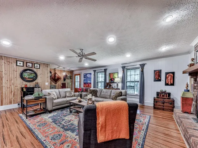 a living room with furniture and a rug