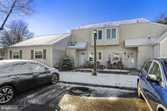 a front view of a house with parking space