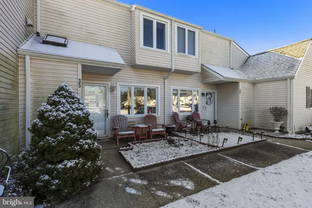 a view of multiple houses with a road
