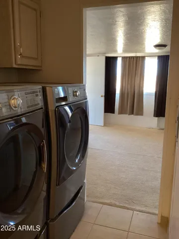 a view of a big room with windows and cabinet