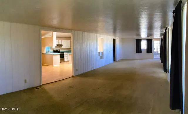 a view of gym equipment with wooden floor