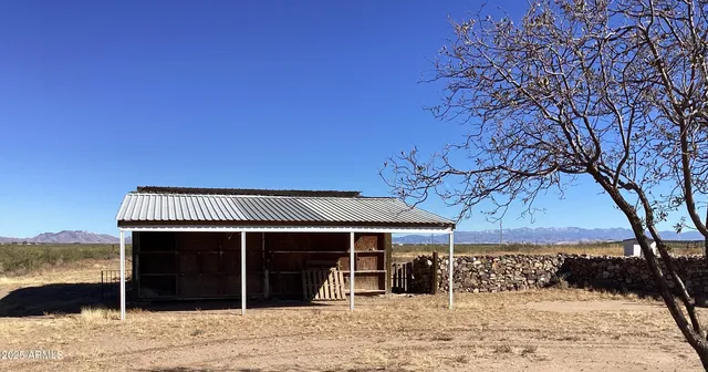 a view of kitchen with furniture and wooden floor