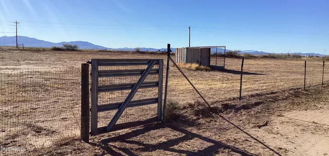 a view of a house with a snow in the background