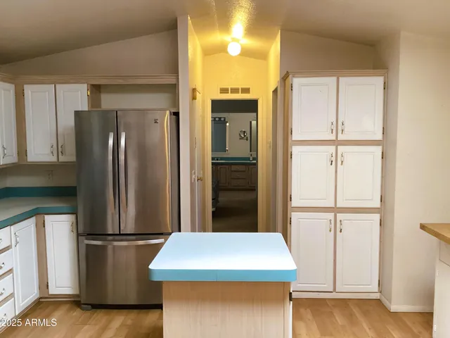 a view of hallway with a door and a hallway