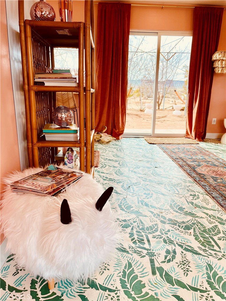 56345 Moonstone Road Yucca Valley, CA 92284 - Photo 14 of 69 a view of a livingroom with furniture and window
