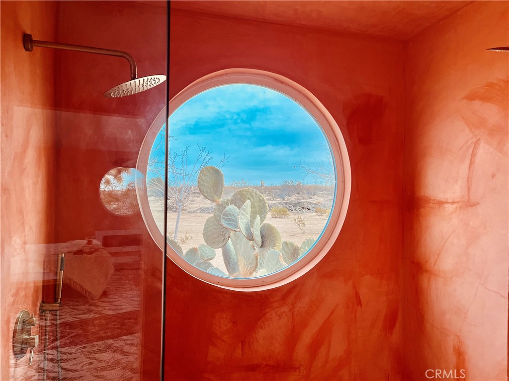 56345 Moonstone Road Yucca Valley, CA 92284 - Photo 3 of 69 a picture of a bathroom with a sink and mirror