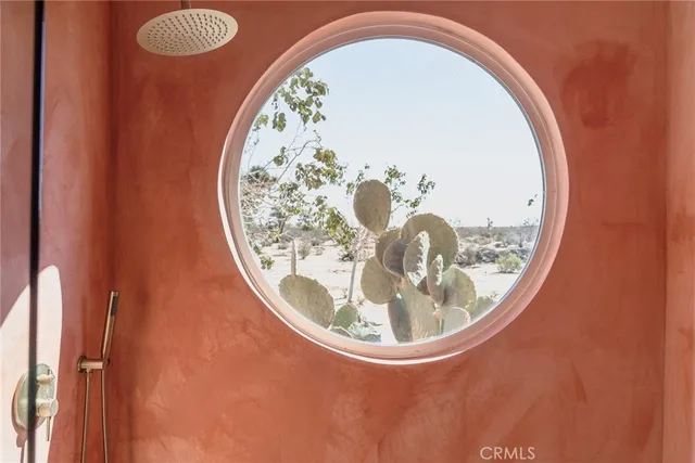 a view of a balcony with table and chairs