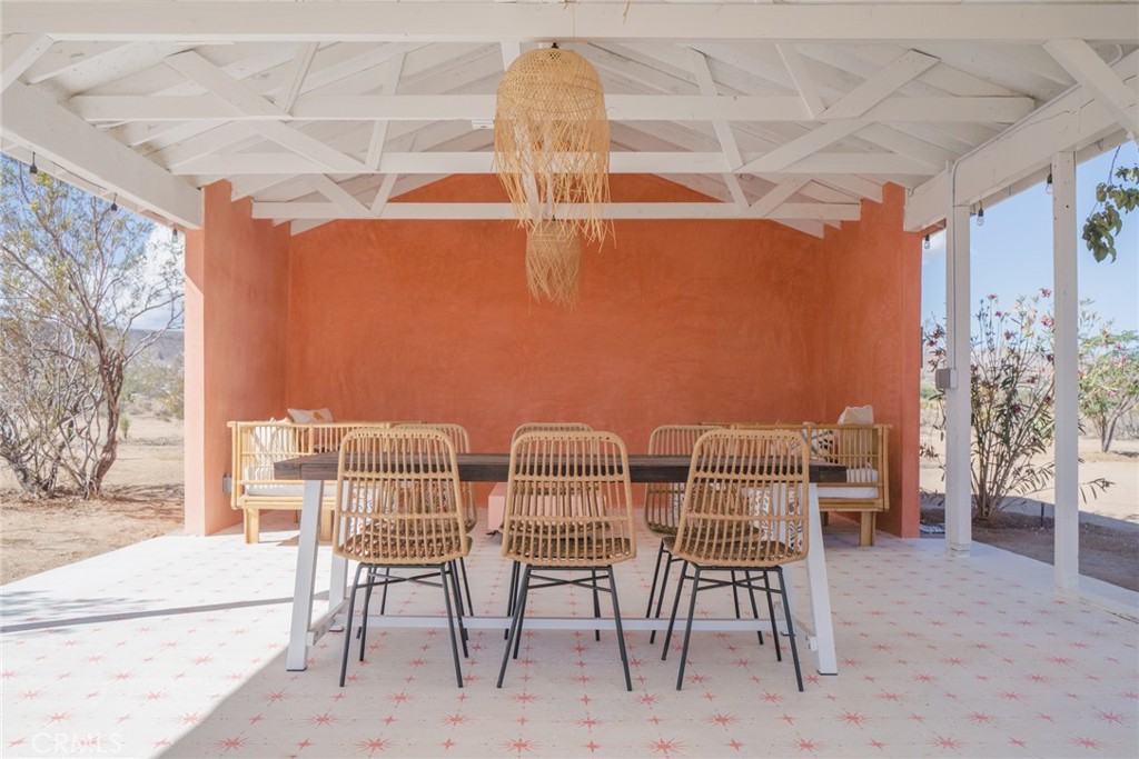 56345 Moonstone Road Yucca Valley, CA 92284 - Photo 35 of 69 a view of a dining room with furniture and wooden floor