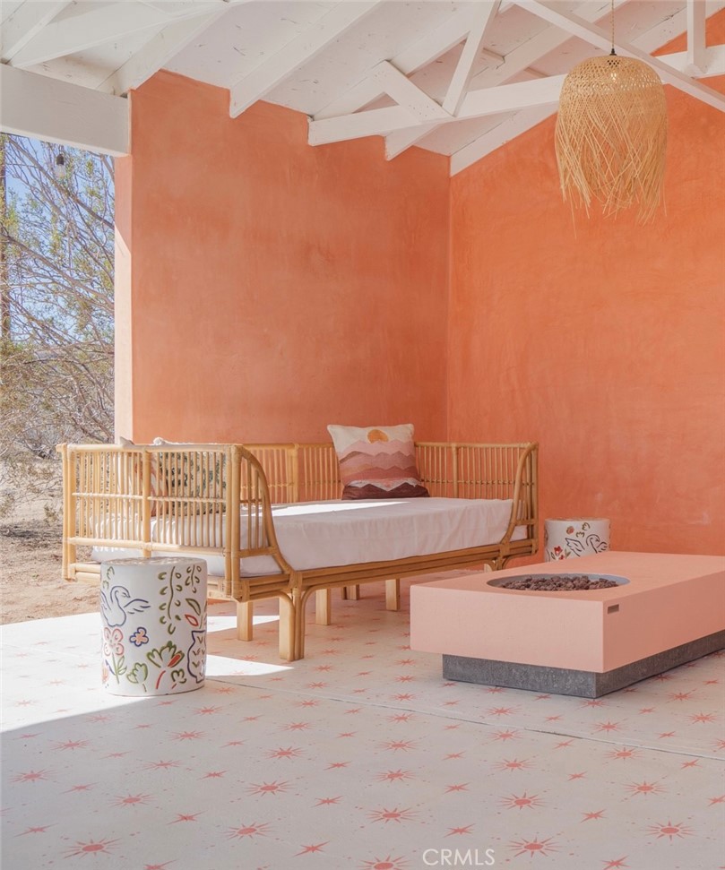 56345 Moonstone Road Yucca Valley, CA 92284 - Photo 37 of 69 a view of a terrace with a table and chairs