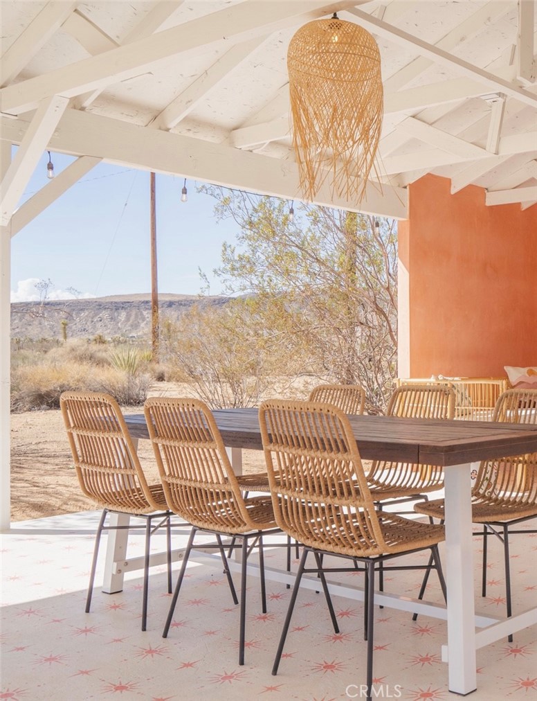 56345 Moonstone Road Yucca Valley, CA 92284 - Photo 40 of 69 a view of a balcony with table and chairs
