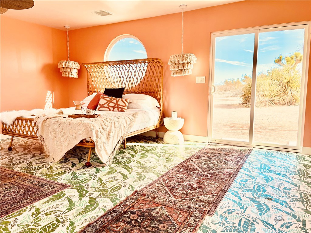 56345 Moonstone Road Yucca Valley, CA 92284 - Photo 4 of 69 a bedroom with a bed and a window