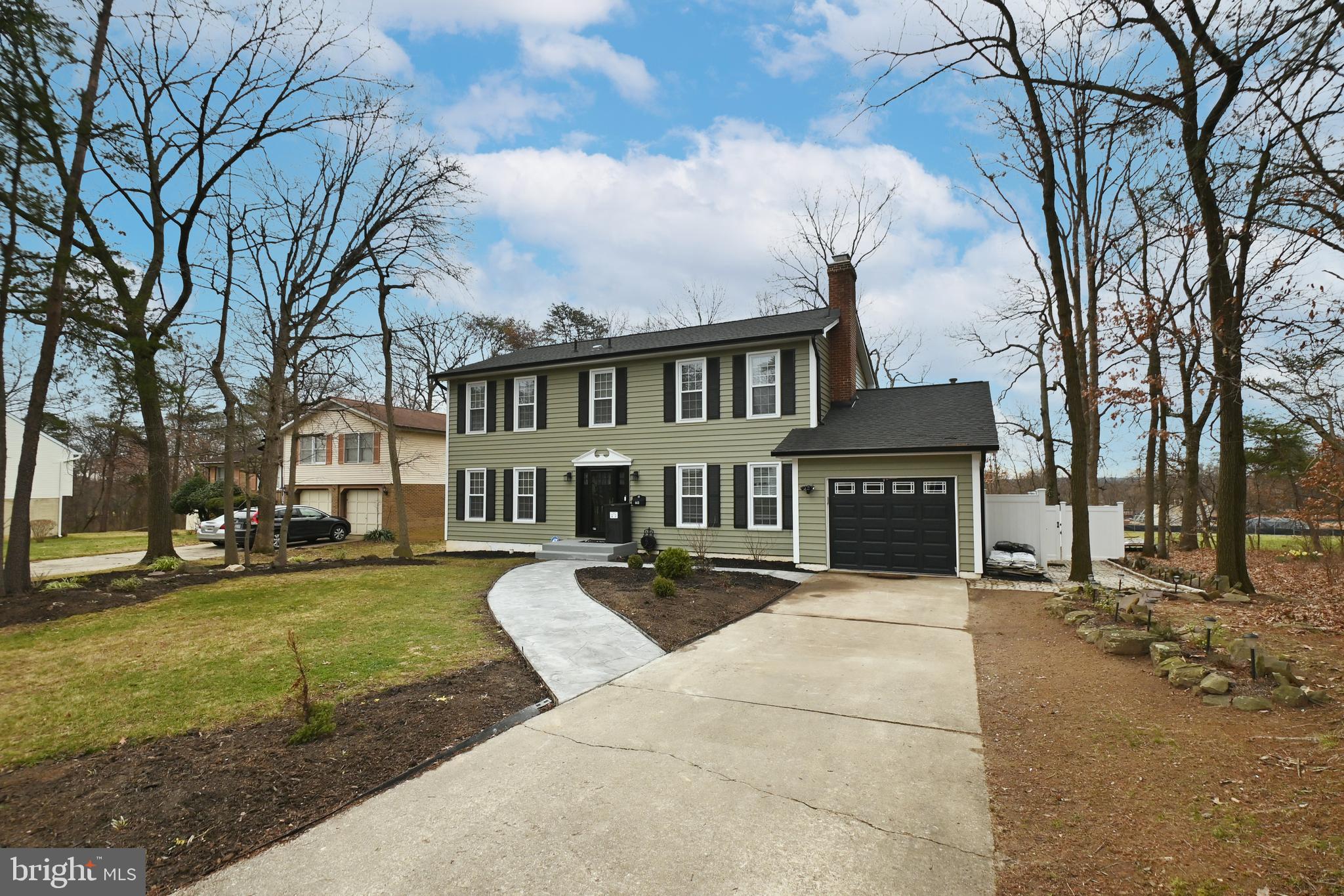 6431 Forest Road Landover, MD 20785 - Photo 1 of 42 a view of a white house in front of a big yard with large trees