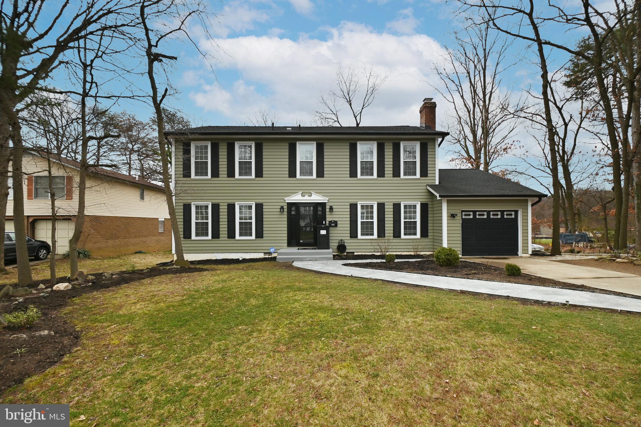 6431 Forest Road Landover, MD 20785 - Photo 2 of 42 a front view of a house with a yard