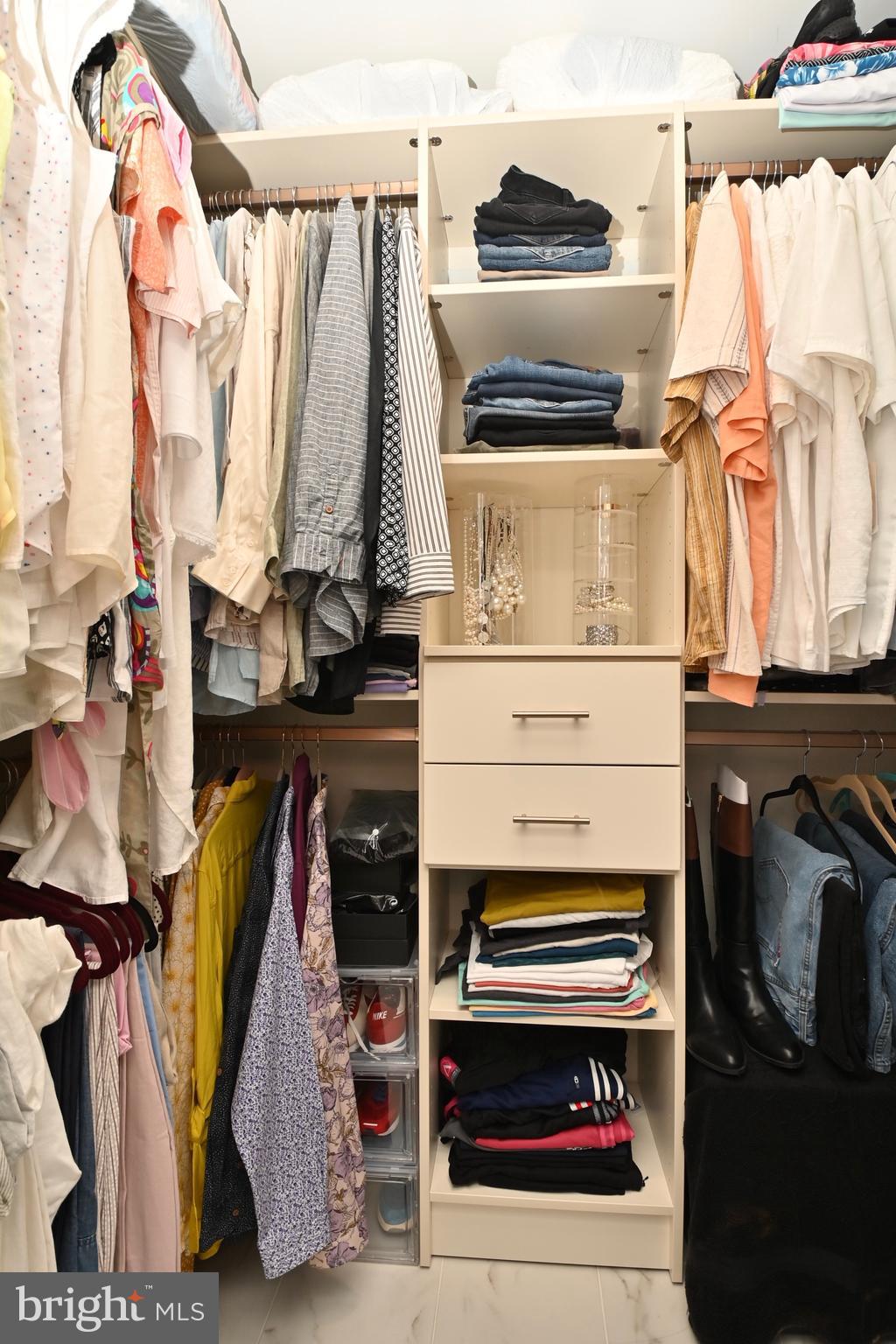 6431 Forest Road Landover, MD 20785 - Photo 22 of 42 a view of walk in closet with clothes and shoes