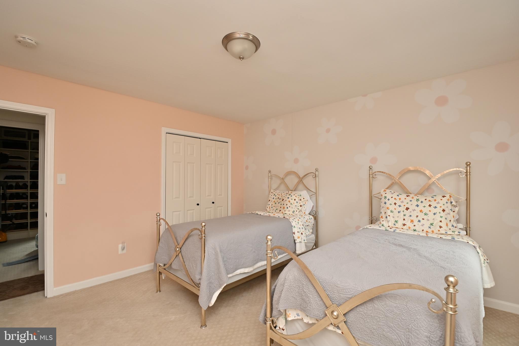 6431 Forest Road Landover, MD 20785 - Photo 27 of 42 a bedroom with two beds and painted walls