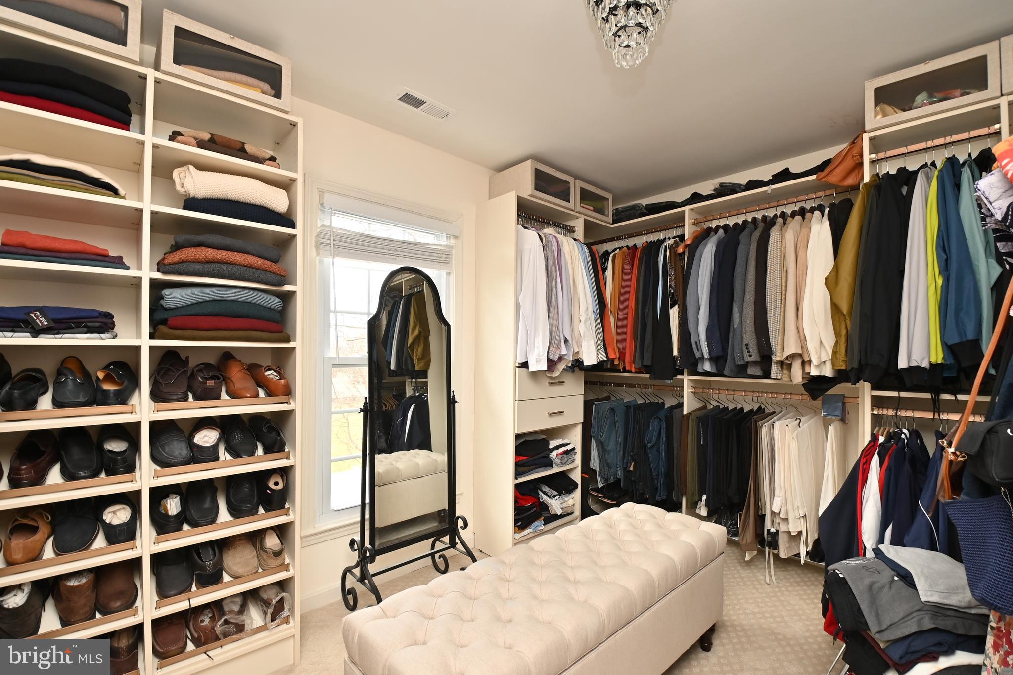 6431 Forest Road Landover, MD 20785 - Photo 31 of 42 a view of walk in closet with clothes and shoes
