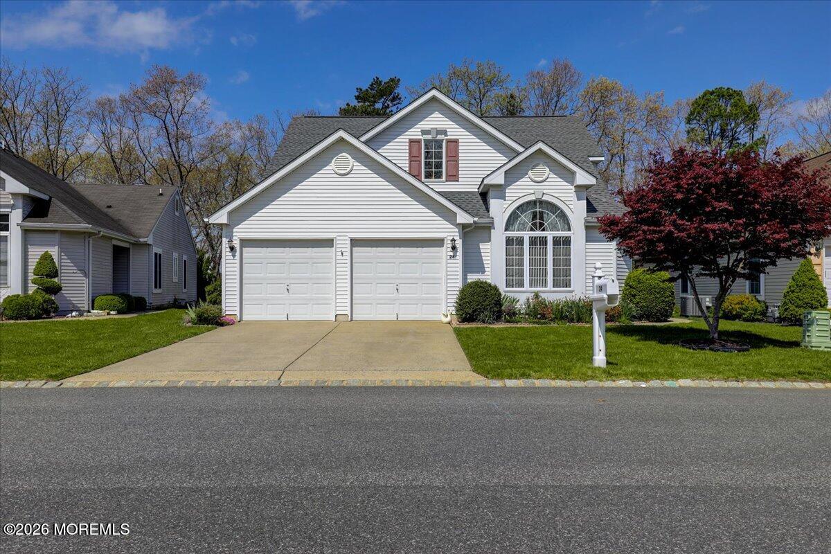 24 Merion Lane Jackson, NJ 08527 - Photo 2 of 45 a front view of a house with garage and plants