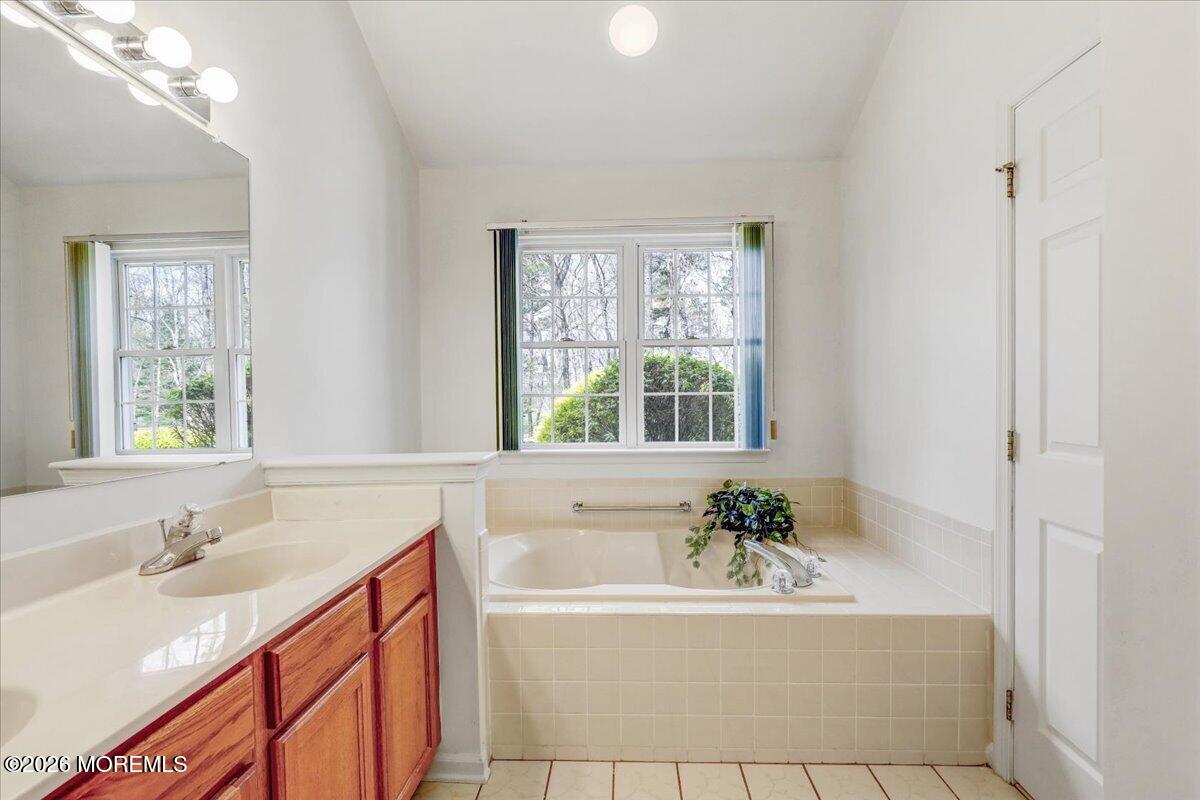 24 Merion Lane Jackson, NJ 08527 - Photo 21 of 45 a white bath tub sitting next to a white sink