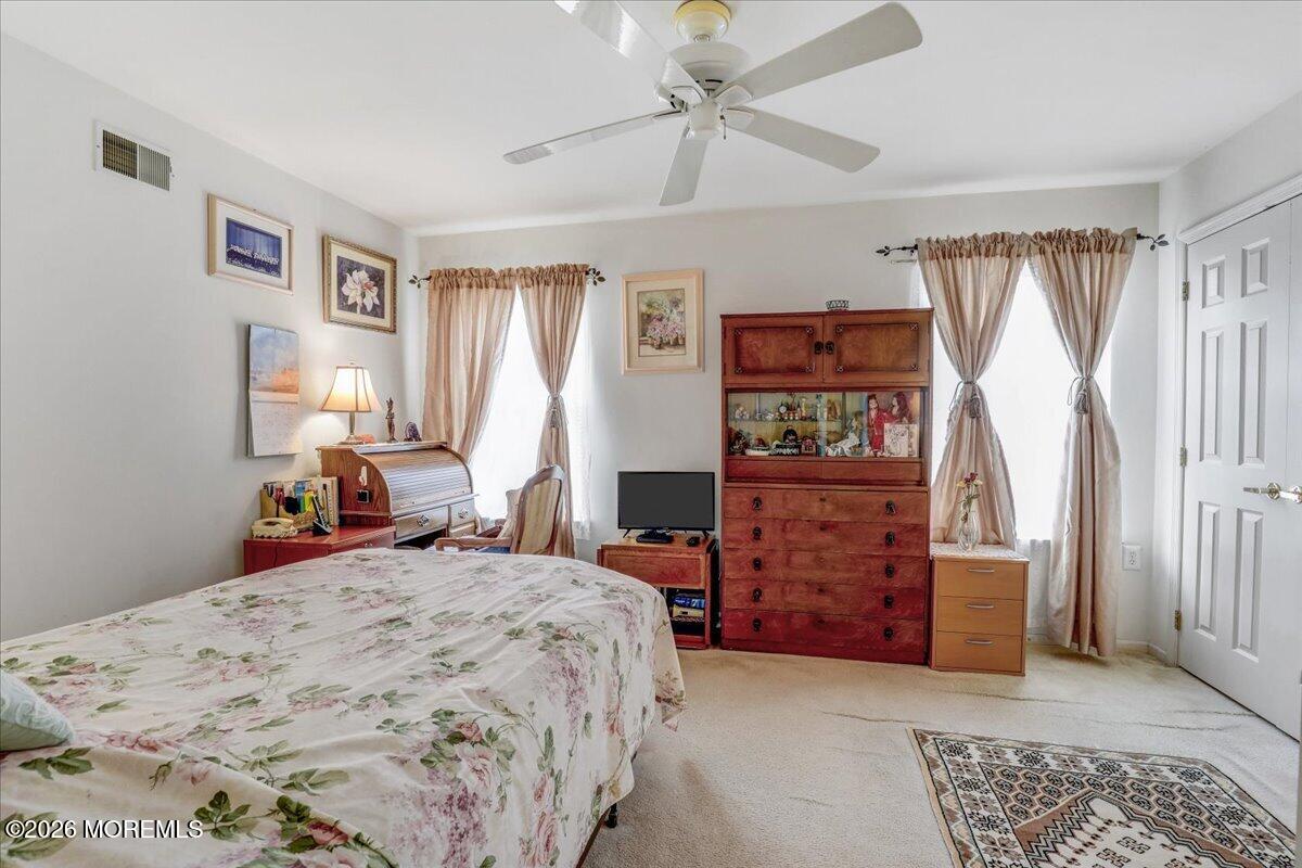 24 Merion Lane Jackson, NJ 08527 - Photo 26 of 45 a bedroom with a bed and a dresser