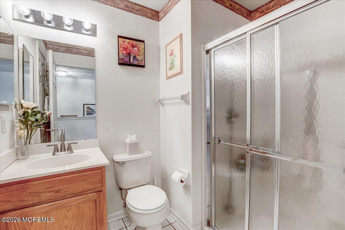 24 Merion Lane Jackson, NJ 08527 - Photo 27 of 45 a bathroom with a toilet a sink and shower