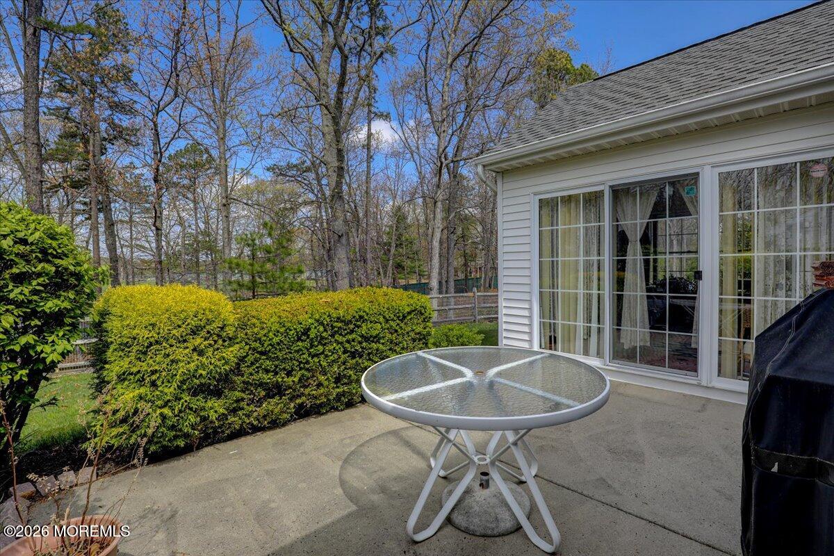 24 Merion Lane Jackson, NJ 08527 - Photo 28 of 45 a view of a backyard with table and chairs