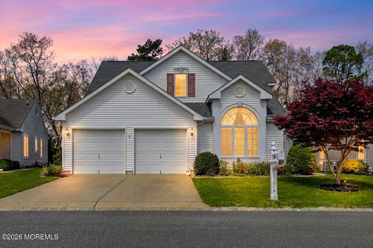 24 Merion Lane Jackson, NJ 08527 - Photo 3 of 45 a front view of a house with a yard and garage