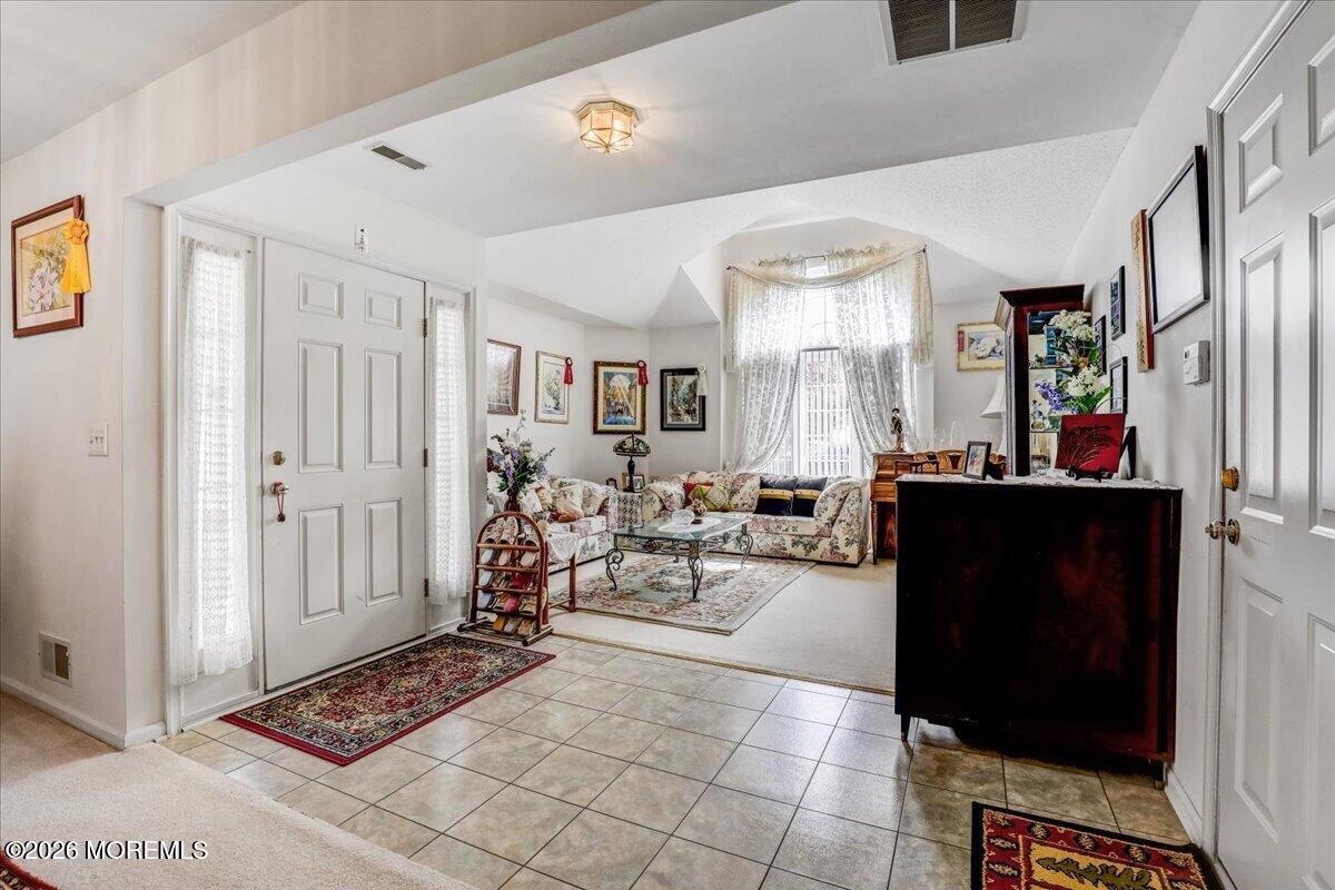 24 Merion Lane Jackson, NJ 08527 - Photo 4 of 45 a living room with furniture and a window