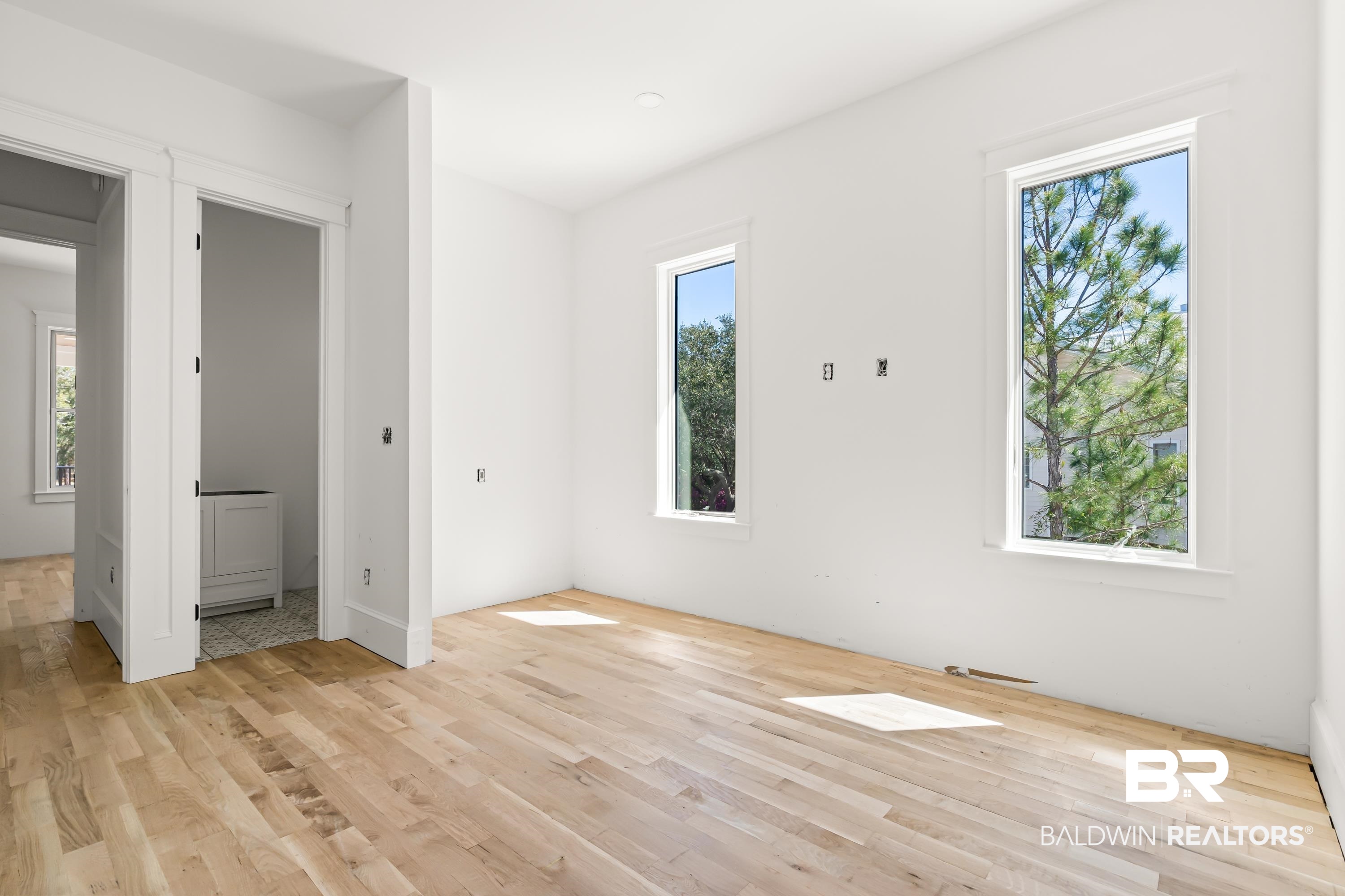 14686 State Highway Gulf Shores, AL 36542 - Photo 23 of 44 Unfurnished bedroom featuring light wood-style floors