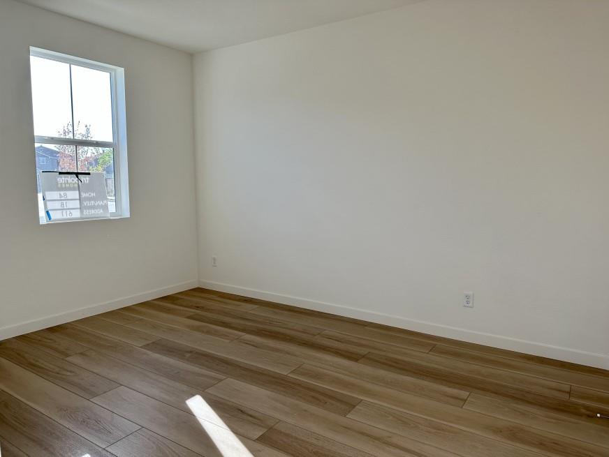 611 Willow Bend Lathrop, CA 95330 - Photo 7 of 11 a view of empty room with wooden floor and fan
