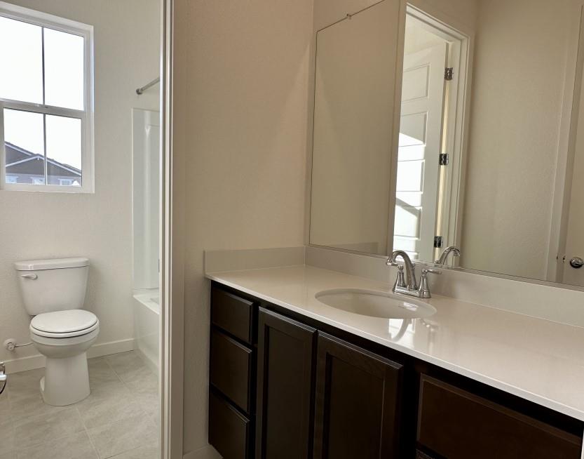 611 Willow Bend Lathrop, CA 95330 - Photo 10 of 11 a bathroom with a sink and a toilet