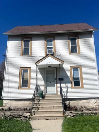 a front view of a house with garage