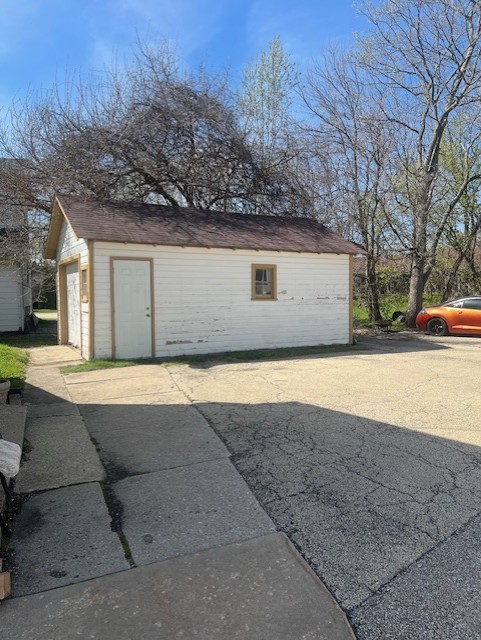 465 East State Street Sycamore, IL 60178 - Photo 6 of 8 a front view of a house with a yard and garage