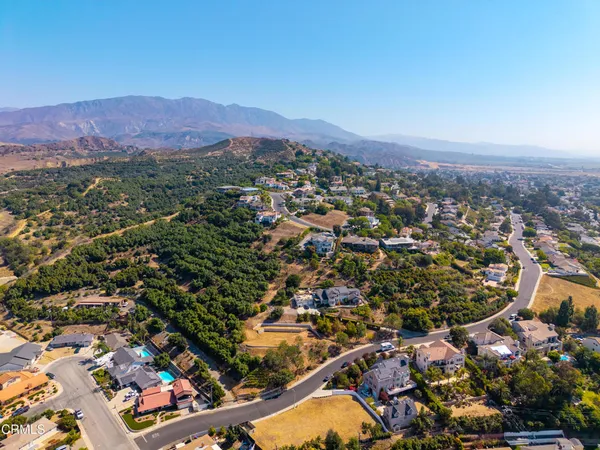 an aerial view of residential houses and city view