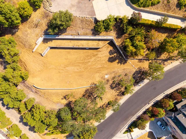 a view of swimming pool from a balcony