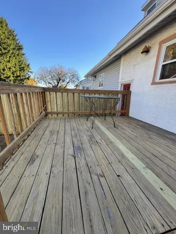 a balcony with wooden floor