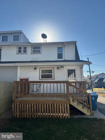 a view of a house with backyard and porch