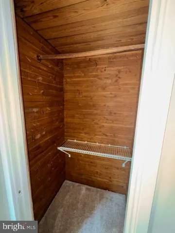 a bathroom with a sink toilet and a mirror