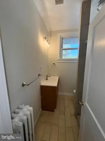 a view of a hallway to rooms and stairs