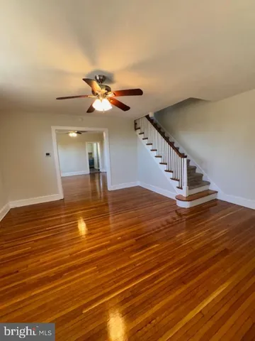 a view of a room with wooden floor