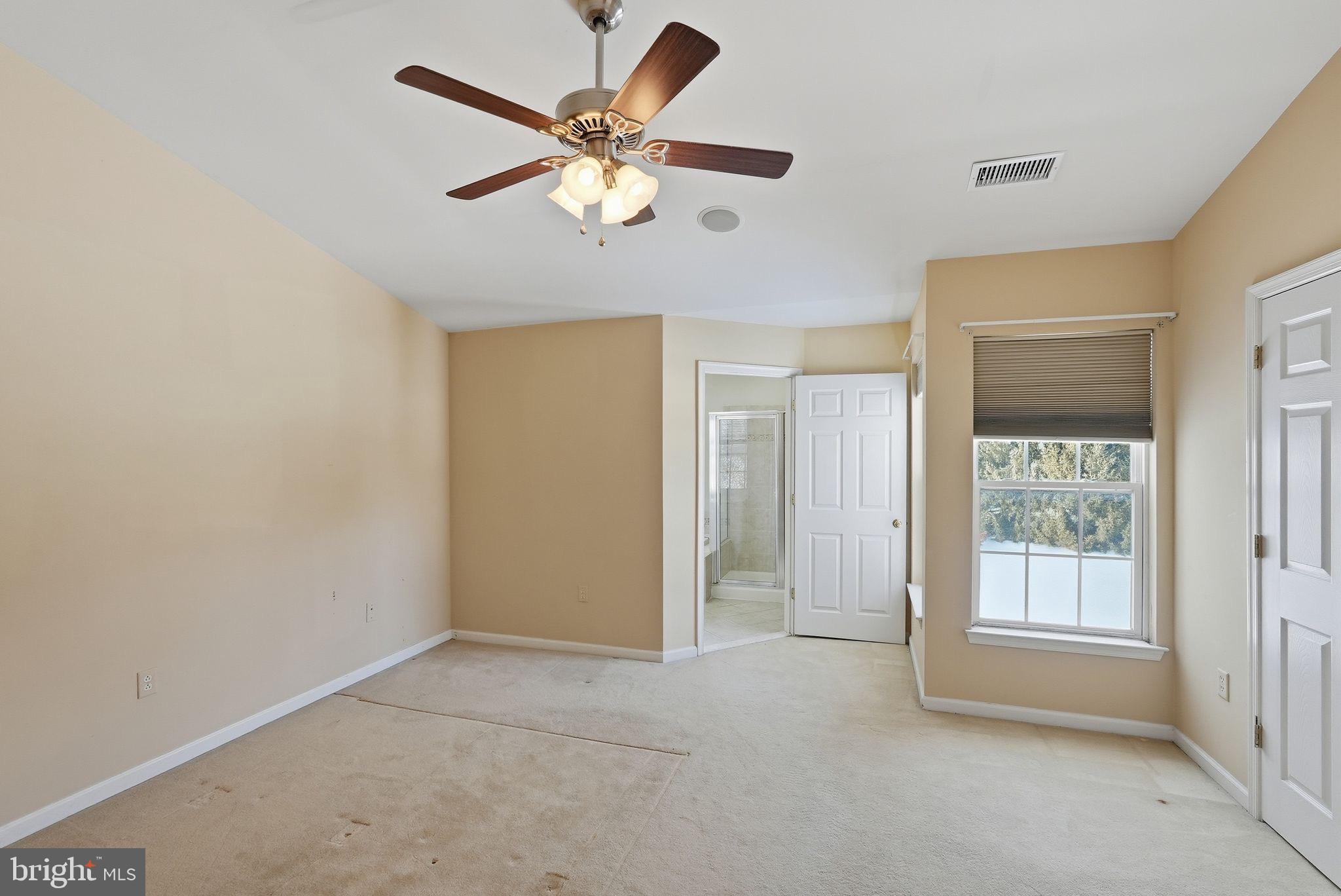 3 Carriage House Road Pottstown, PA 19465 - Photo 15 of 26 Spacious room with natural light and ceiling fan.