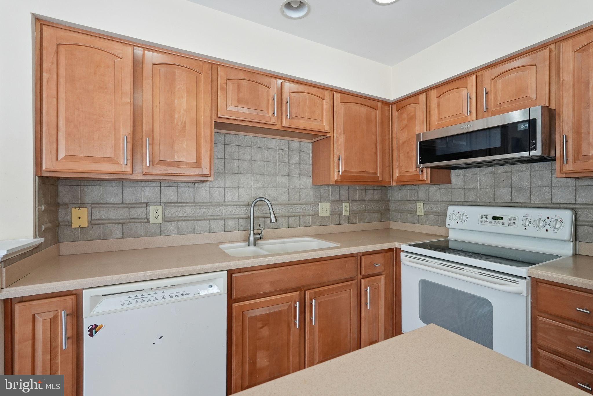 3 Carriage House Road Pottstown, PA 19465 - Photo 10 of 26 Modern kitchen with warm wood cabinetry.