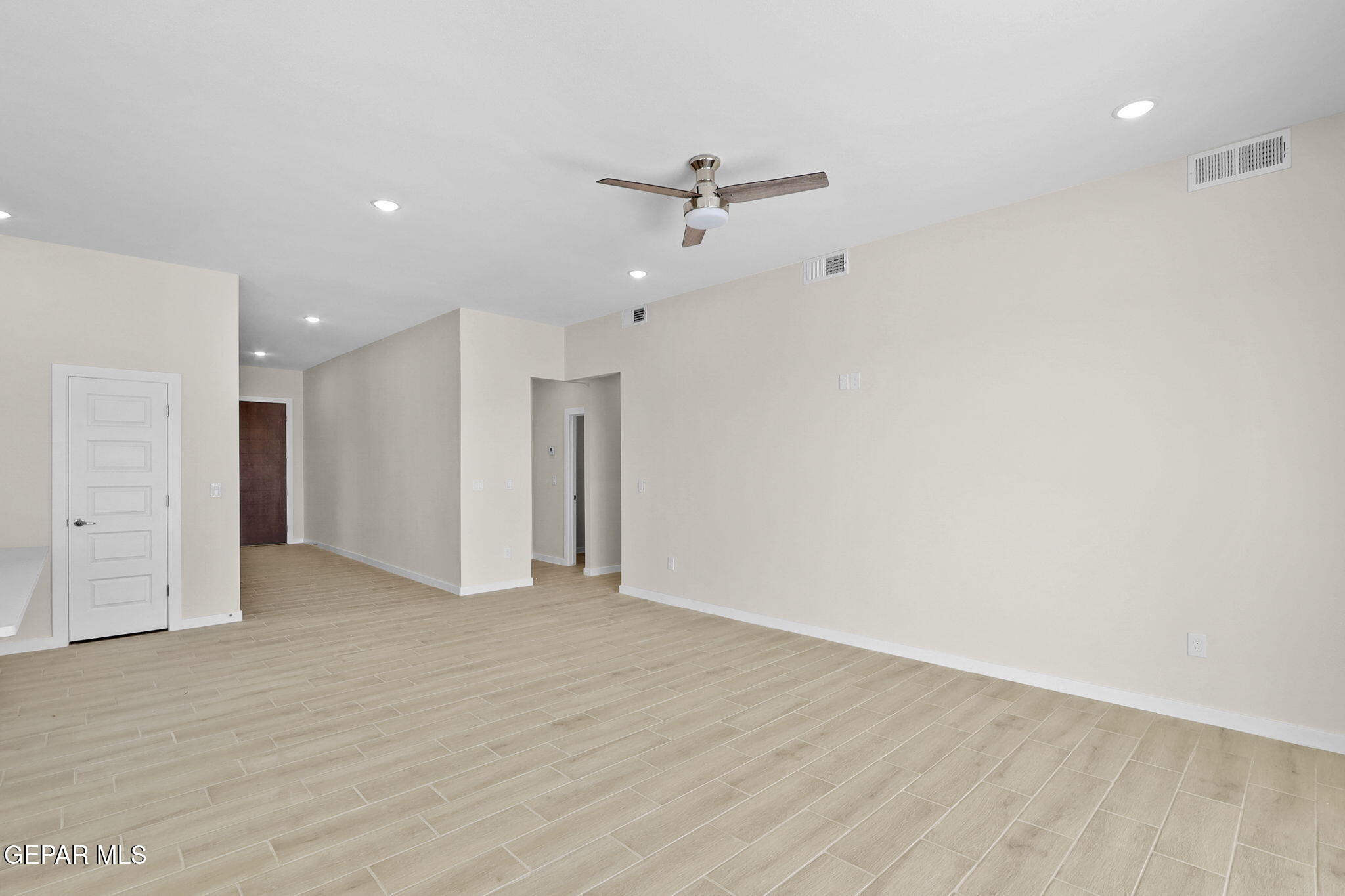 8409 Phil Place Vinton, TX 79821 - Photo 12 of 20 a view of an empty room with a ceiling fan